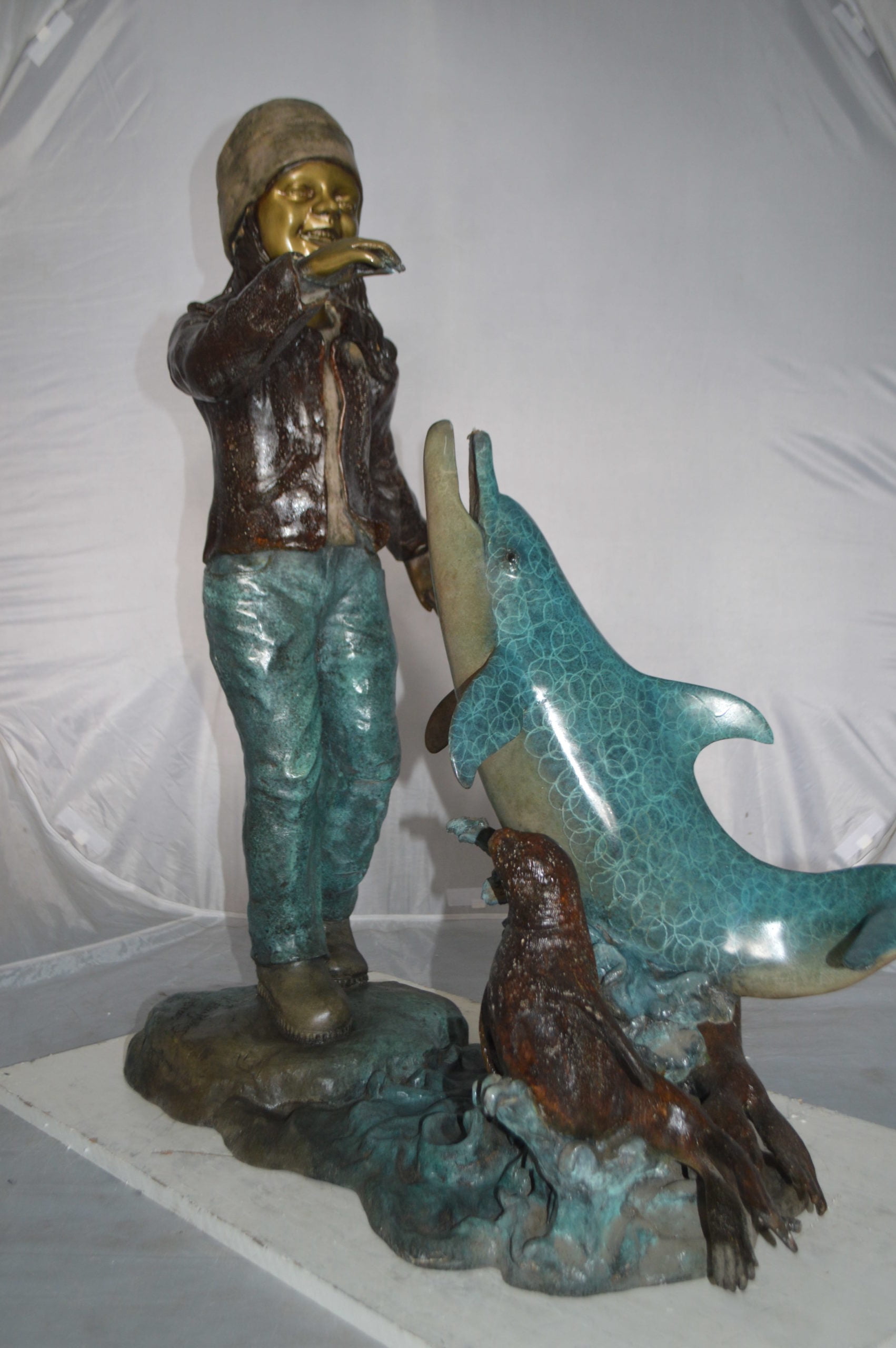 Nifao Girl feeding a dolphin and seals – Outdoor Bronze Fountain, Garden Water Feature, 28"L x 17"W x 37"H