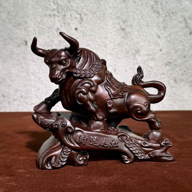 Ebony wood carved ox figurine, symbolizing good fortune and soaring success, perfect for living room, company desk, office desk, or business opening.