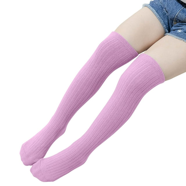 FAIWAD Girls Classic Cable Knit Over the Knee Socks in a soft pink colour, designed for daily wear, ballet, or cosplay. These knee-high socks feature a ribbed texture and a snug fit that extends over the calf. Made from high-quality, breathable, and durable fabric, they provide comfort and support for various activities. Suitable for all seasons and occasions, including casual outings, school, or parties.