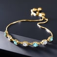 thumbnail image 3 of Gem Stone King 18K Yellow Gold Plated Silver Swiss Blue Topaz and White Moissanite Tennis Bracelet for Women (2.99 Cttw, Round 4.5MM, Fully Adjustable up to 9 inch), 3 of 4