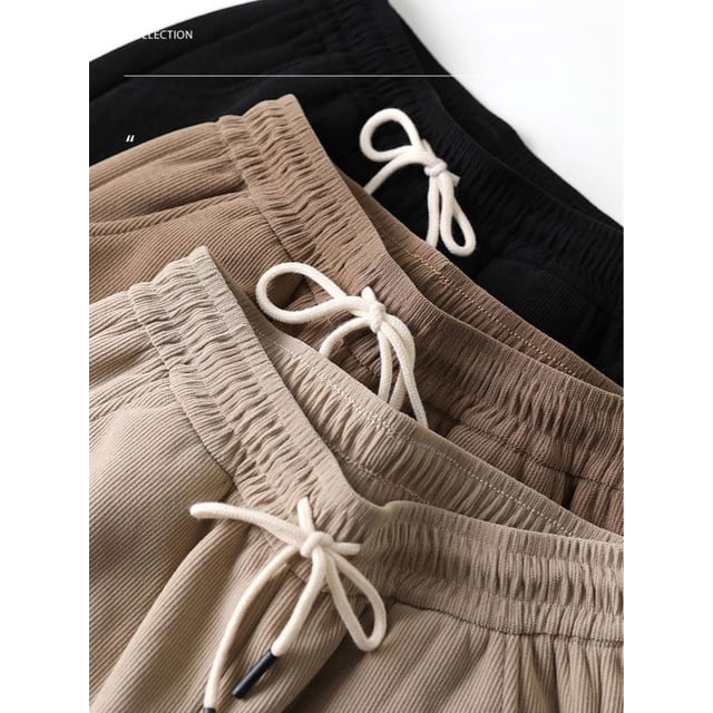 Pantalones deportivos de lana populares con correas de tobillo de algodón grueso, pantalones térmicos de rayas verticales para mujer