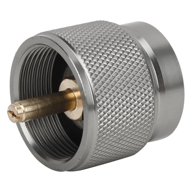 heitune convertidor de adaptador de recarga de tanque de propano estándar de ee. uu. con gas de cierre automático, adaptador cilíndrico de aleación de aluminio con núcleo de cobre visible, vista 3/4 que muestra roscas internas y superficie exterior estriada para agarre; tamaño aprox. 3.5x3 cm. Diseñado para conectar válvulas de boquilla de estufa a tanques estándar EE. UU.; a menudo usado como conector portátil para recargas.