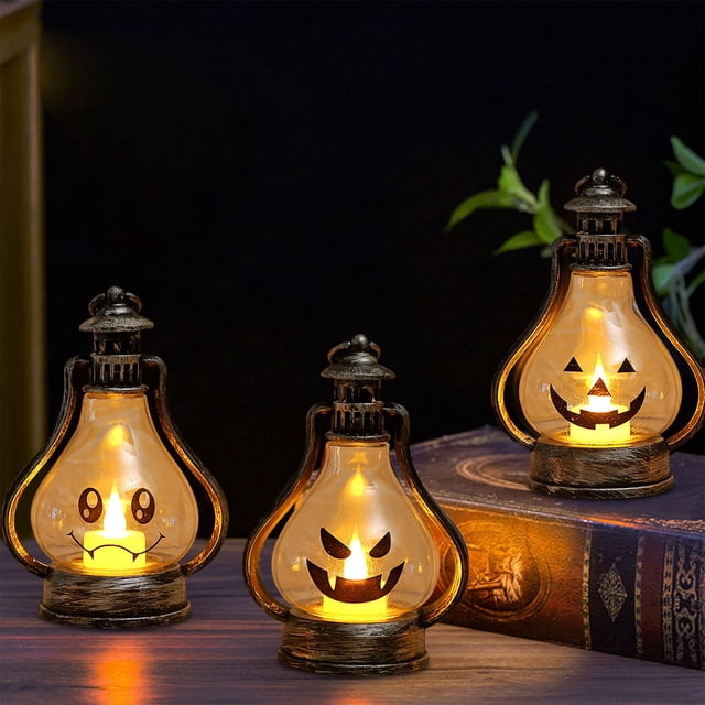 xihbxyly linterna de halloween, decoración con luz led portátil multicolor: tres linternas 6,9 x 10,8 x 15 cm con cuerpo tipo bombilla y base rústica, LED cálida interior y caras de calabaza recortadas; colocadas sobre mesa y libro, aporta decoración de temporada para fiestas de Halloween.