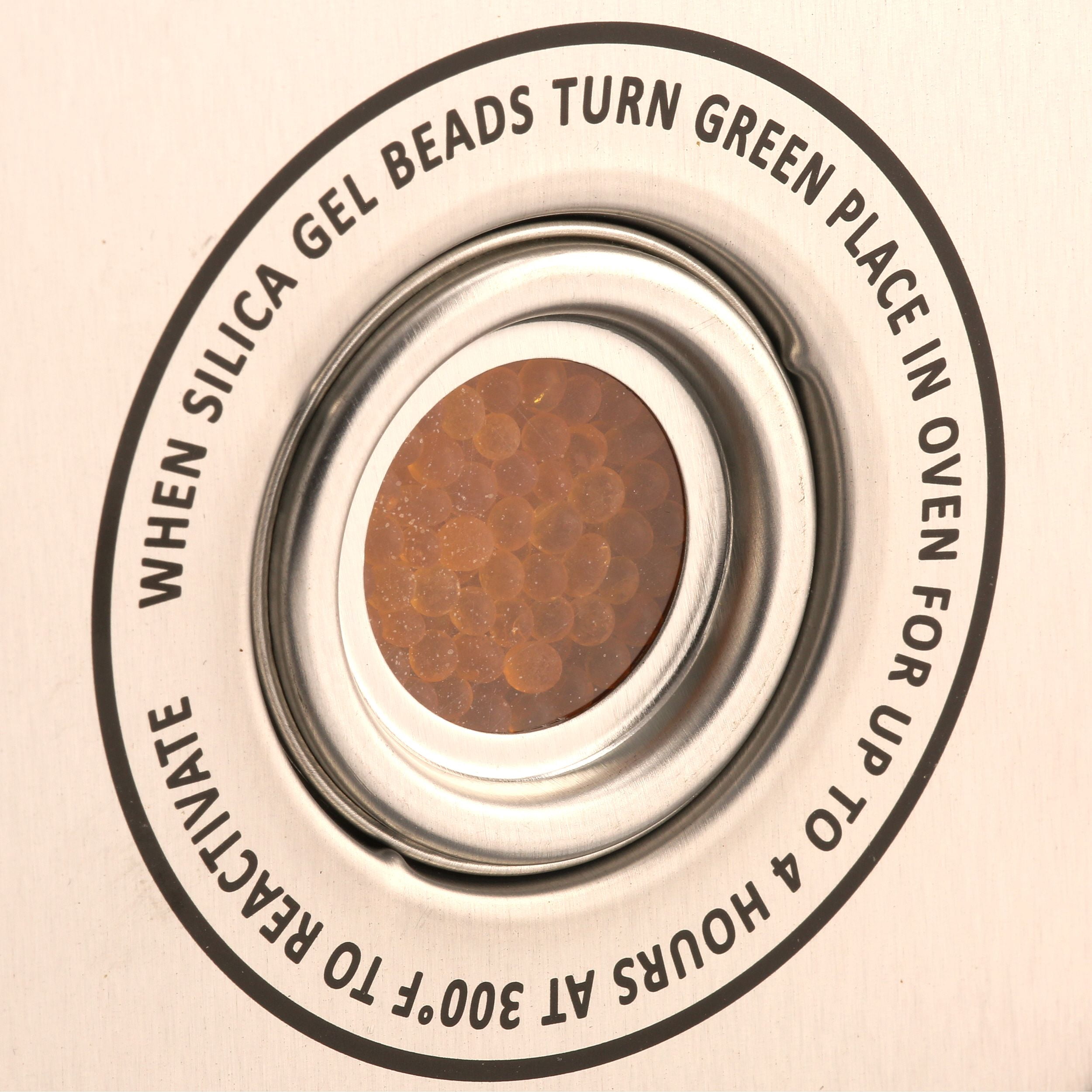 Stack on moisture control desiccant canister