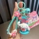 thumbnail image 1 of Llavero con colgante de cámara de proyección de dibujos animados de Sanrio con forma de perro de orejas grandes de peluche para mujer, 1 of 6