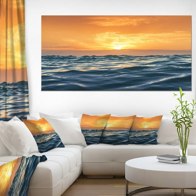 Blue Waves Dancing at Yellow Sunset
