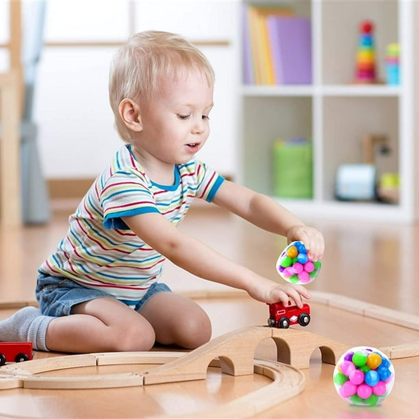 Enfant Joue à Un Jeu Populaire Avec Des Boutons Un Jouet Anti-stress Jeux  éducatifs Pour Enfants