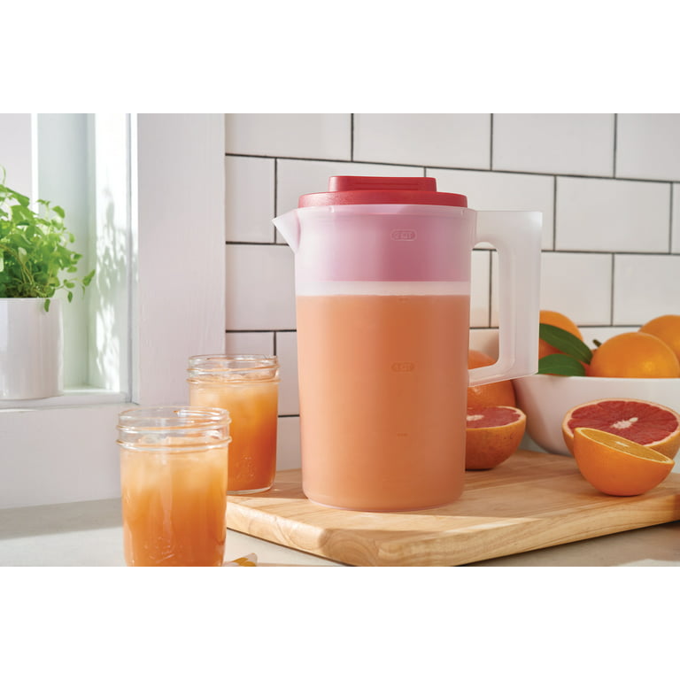 Premium Photo  A pitcher of orange juice with a clear handle and a clear  handle.