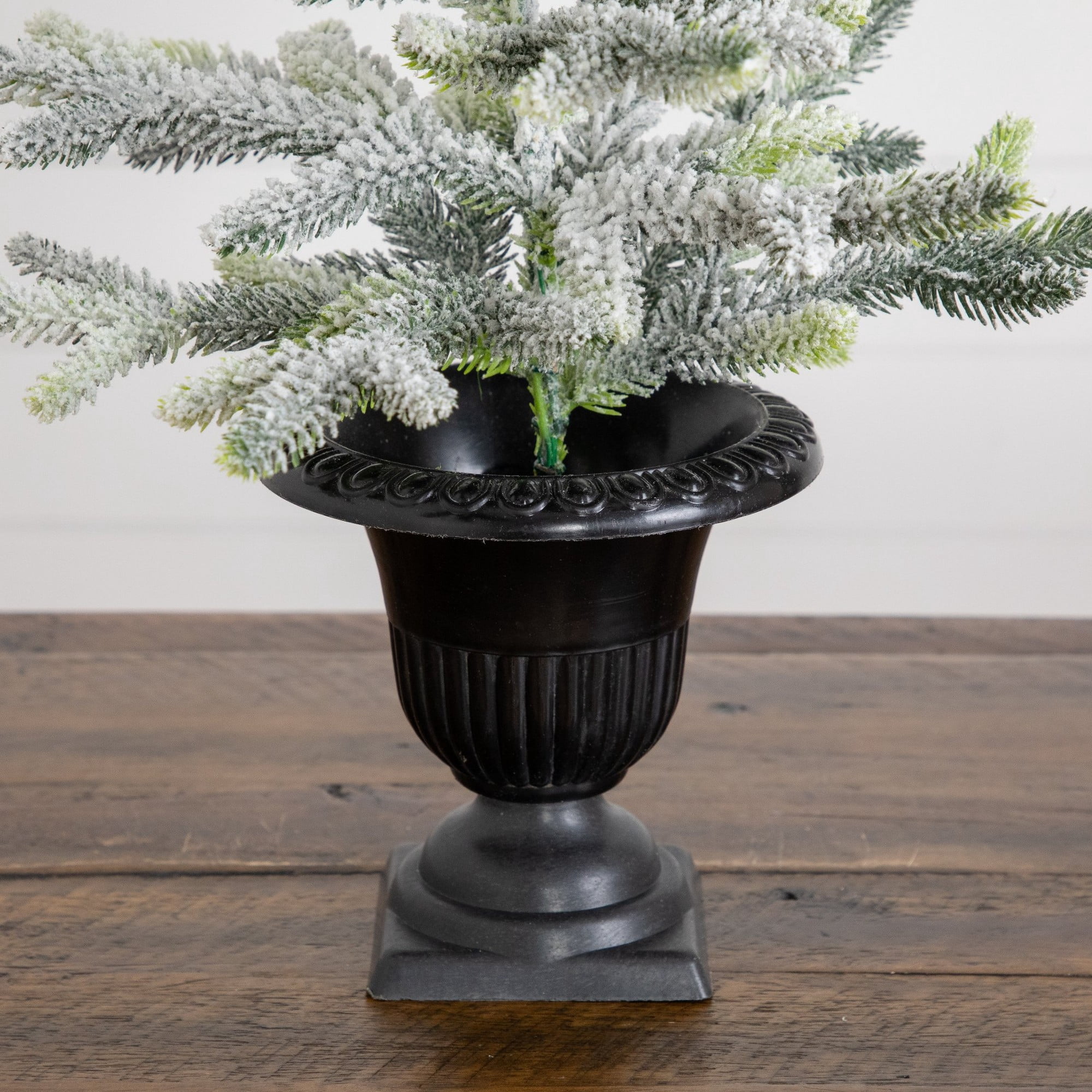 2ft. Artificial Frosted Christmas Tree in Black Decorative Urn