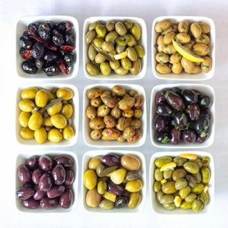 Bowl Frank - Varieties of Olives in bowls on white background Stretched Canvas - Assaf Frank (12 x 12)
