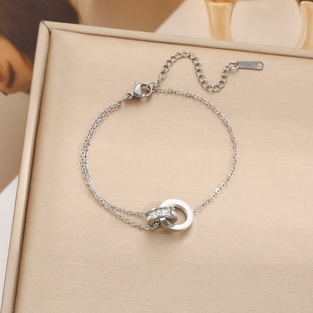 Pulsera de trébol de acero de titanio europea y americana con incrustaciones de concha, pulsera con colgante, pulsera de diseño avanzado que no se decolora