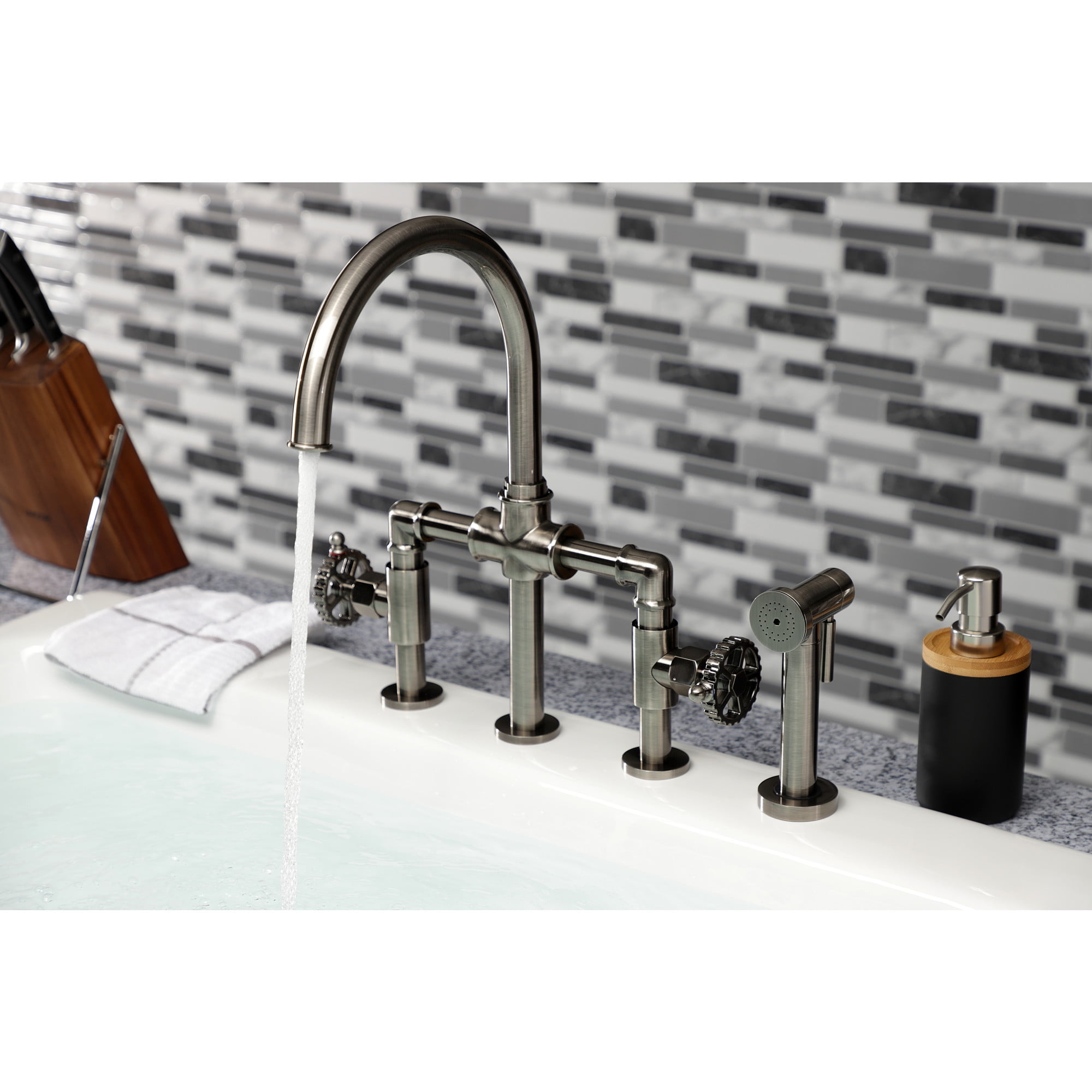 Kingston Brass KS2334CG Fuller Two-Handle 4-Hole Deck Mount Industrial Style Bridge Kitchen Faucet with Brass Side Sprayer in Black Stainless