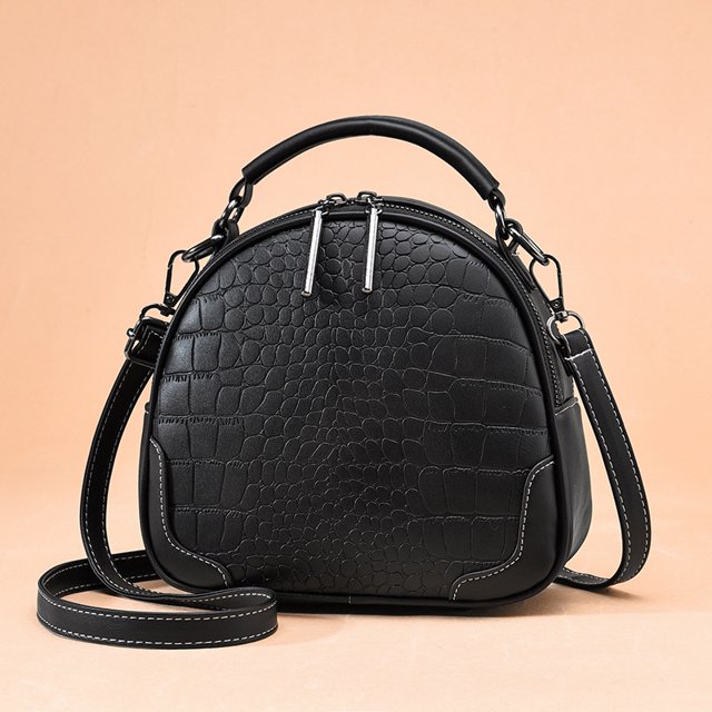Nuevo bolso de mano elegante de lujo de cuero suave cruzado pequeño versátil de alta calidad con borlas de venta directa para mujer