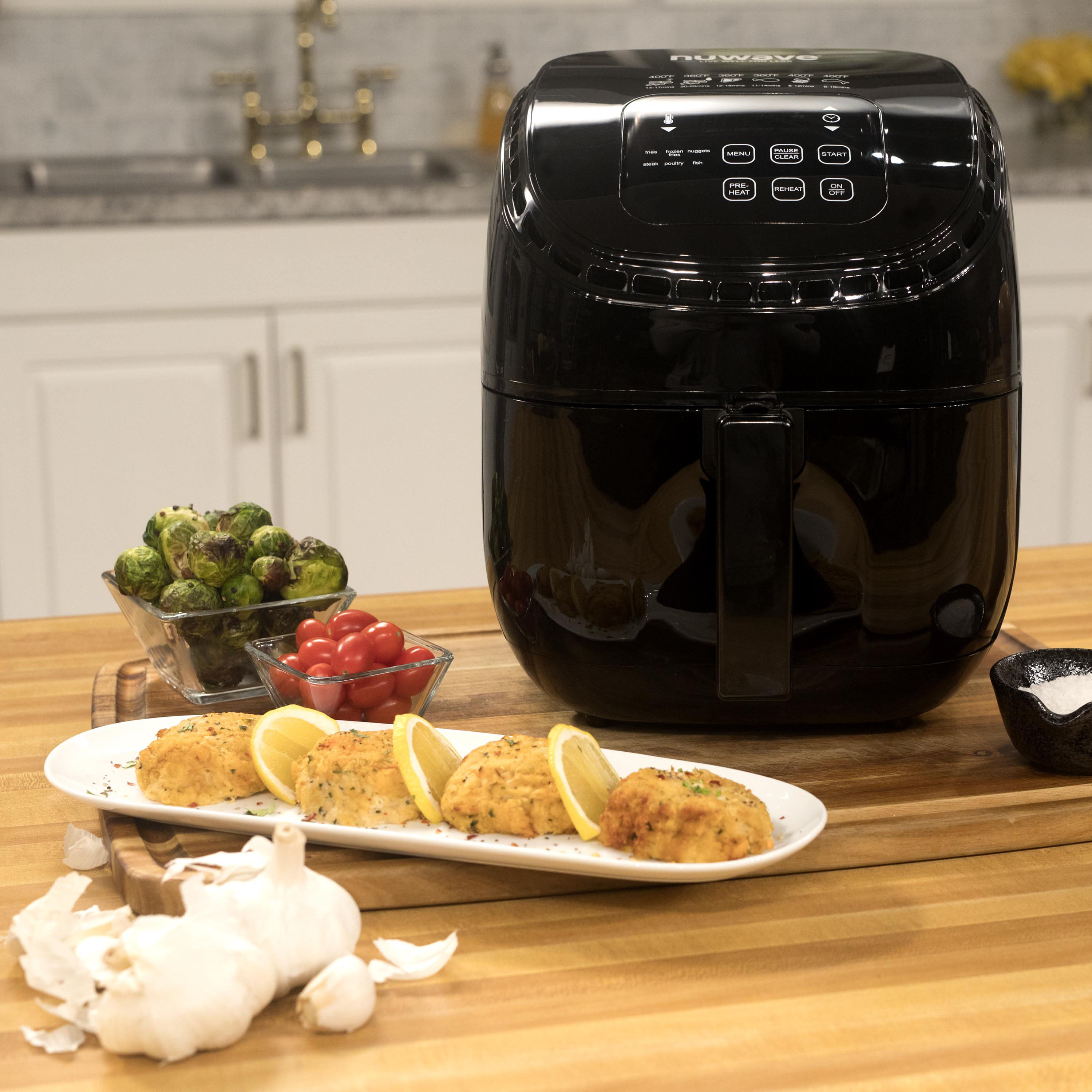 also includes non-stick baking pan and s recipe book precise temperature control and advanced functions like PREHEAT REHEAT and more wattage control NUWAVE BRIO 3-Quart Digital Air Fryer cooking package with one-touch digital controls 6 easy presets 