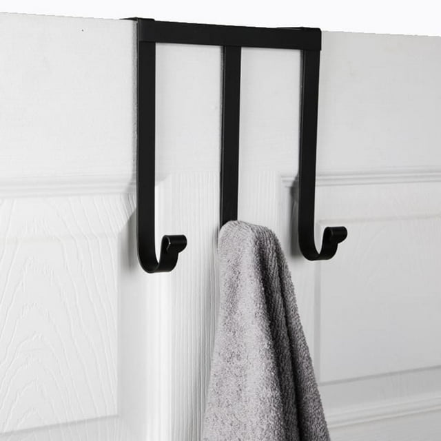 Black era Niagara over-the-door rack with three hooks hanging a gray towel on a white door.