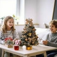 thumbnail image 4 of Mini árbol de Navidad con luces DIY | Adorno navideño de mesa predecorado de 45 cm | Decoración navideña de PVC para escritorio, estantería o ventana | Incluye guirnalda de luces y base de madera, 4 of 6