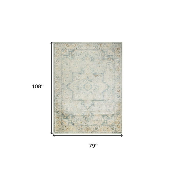 7' X 9' Blue and Ivory Floral Medallion Power Loom Distressed Washable Area Rug