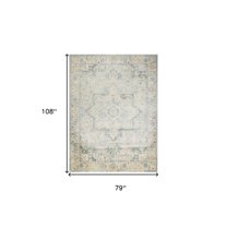 7' X 9' Blue and Ivory Floral Medallion Power Loom Distressed Washable Area Rug