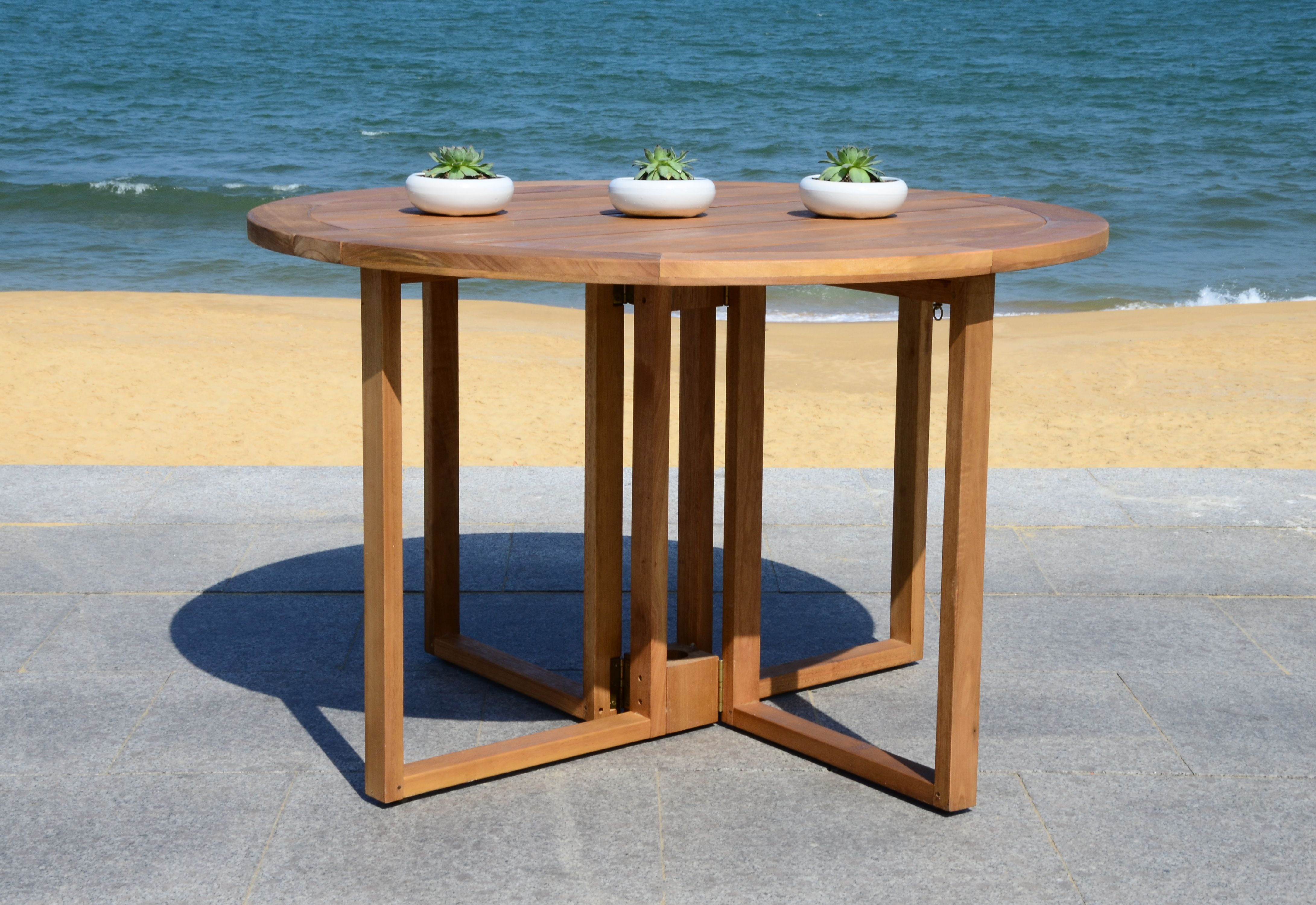 Foldable round dining table