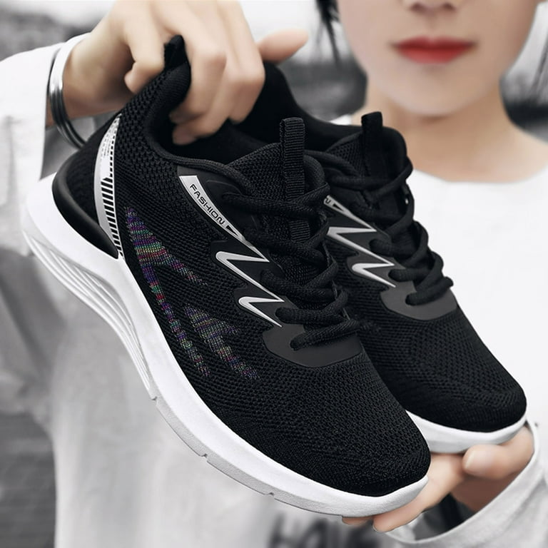 White running shoes with black cheap stripes