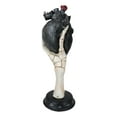 thumbnail image 2 of Gothic Alchemy Skeleton Hand Holding Black Anatomy Heart With Eye Figurine, 2 of 7