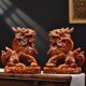 thumbnail image 1 of Large red Qilin figurine, made of wood, featuring male and female fire Qilin, carved from rosewood, a solid wood home feng shui decoration., 1 of 4