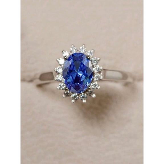 Oval Blue Cubic Zirconia Halo Ring In Silvertone Setting