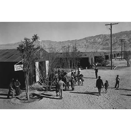 People standing outside Catholic church  Ansel Easton Adams was an American photographer best known for his black-and-white photographs of the American West  During part of his career he was hired