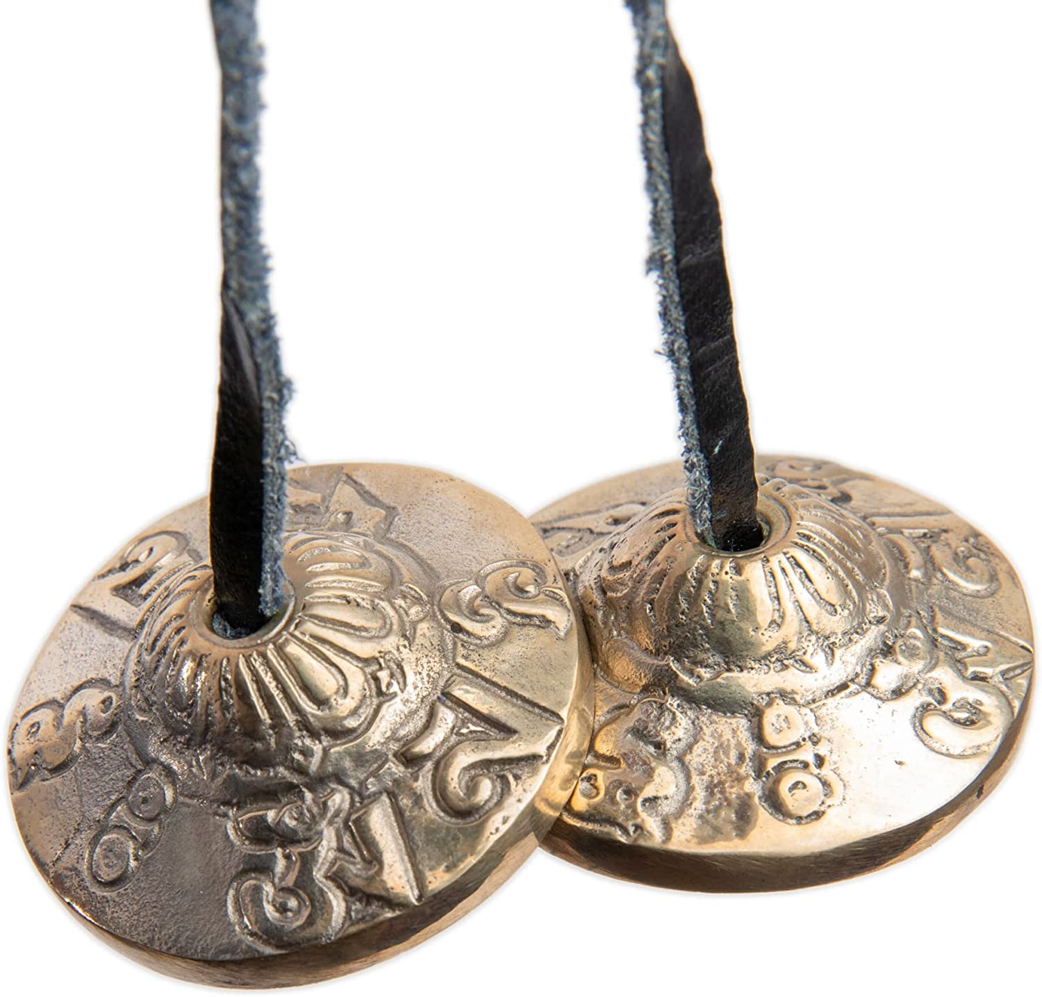 Tingsha Cymbals Tibetan Buddhist Lucky Symbol Embossed Meditation Yoga Bell  Chimes on black contrasting background. Tibetan bells for singing mantra.  Mantra bowls with leather ribbon. Stock Photo
