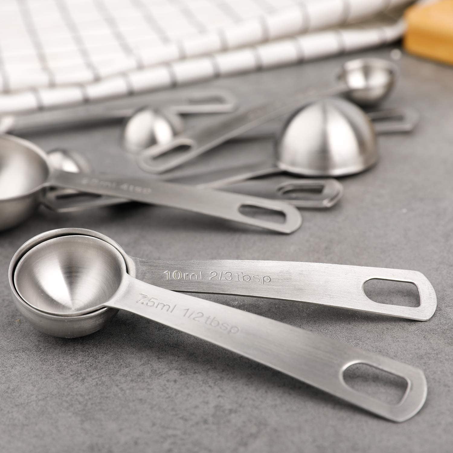 Odd Size Measuring Spoons: Set of 9 spoons ranging from a pinch to a  tablespoon.