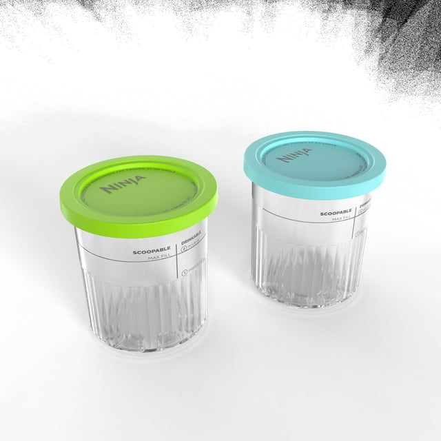 Two clear Ninja Creami Deluxe Pints containers with green and blue lids, labeled scoopable max fill, designed for use with NC500C Ninja Creami Ice Cream Maker.