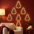 thumbnail image 4 of Velmasee 7 Pcs Wooden Christmas Tree LED Wall Decor - Hollow Out Backlit Rustic Farmhouse Light Up Christmas Tree Wall Stickers, Battery Operated Glowing Xmas Wall Art for Indoor Holiday Home Decor, 4 of 6