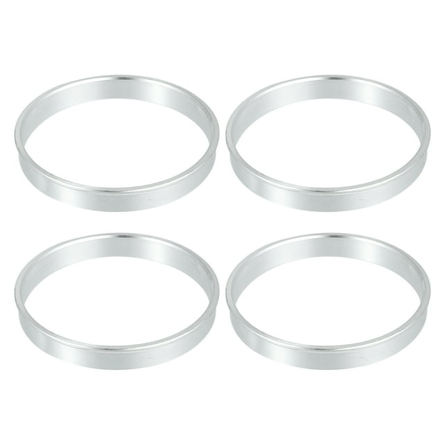 Unique Bargains 4 Pcs 70.6mm to 67.1mm Universal Car Hub Centric Rings in silver tone. These aluminum alloy rings are designed to fill the gap between the vehicle hub and the wheel center bore, ensuring a precise fit and eliminating unwanted steering wheel vibrations. Each ring measures 70.6mm in outer diameter, 67.1mm in inner diameter, and 10mm in thickness. The package includes four hub centric rings suitable for easy installation between the vehicle's hub and the wheel.