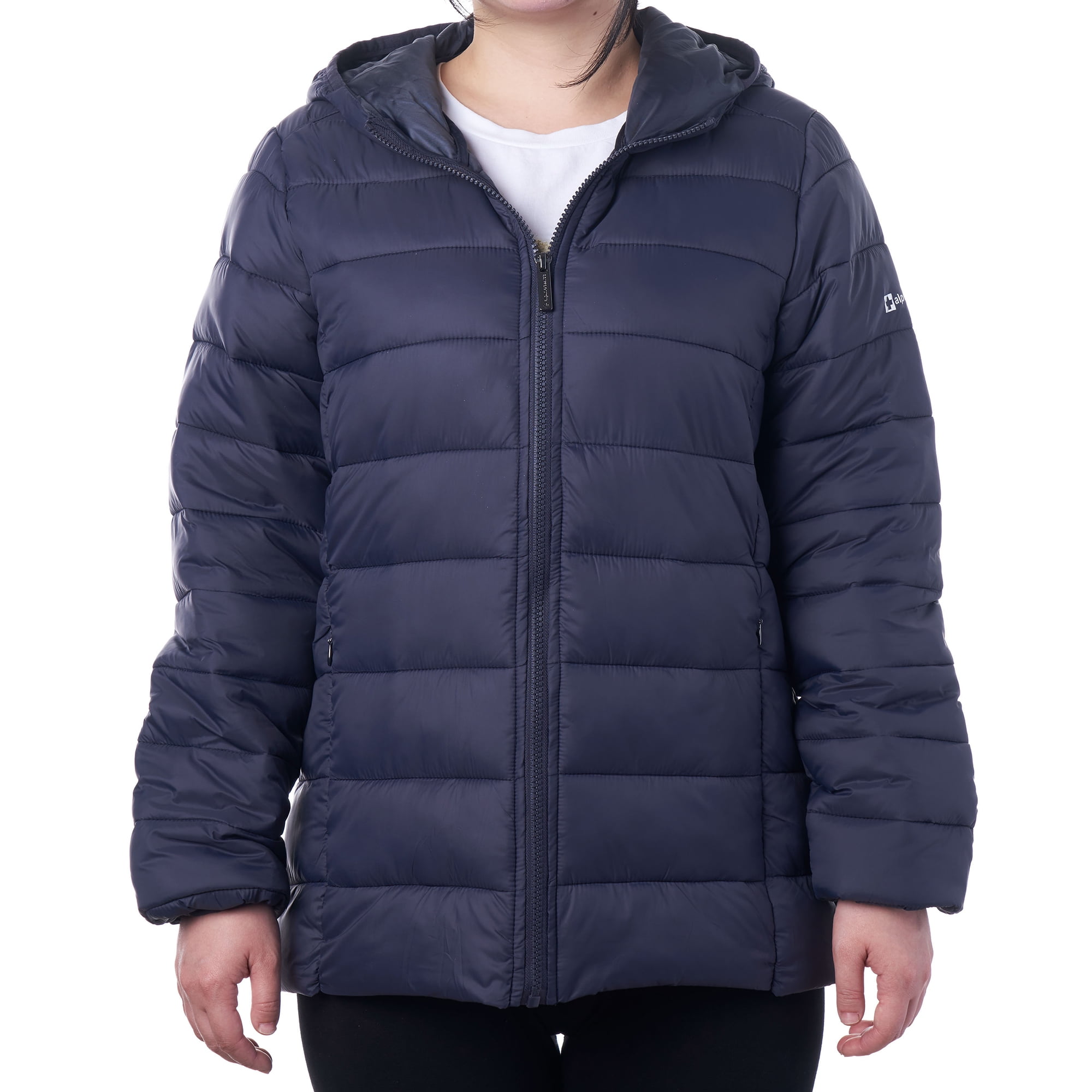 A woman wearing a white t-shirt, black yoga pants, and a navy Alpine Swiss Eva Women’s Hooded Puffer Down Jacket