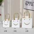 thumbnail image 2 of Nvzi-a gifts, flowers, gift box packaging bags, transparent window gift bags, kraft paper bags, square tote bags (white smiling face, medium), 2 of 4