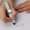 White, variant on Nnndbs Fidget Spinner Pen with Light, Gyroscope Rotating Ballpoint Pen for Stress Relief, ADHD Focus & Office