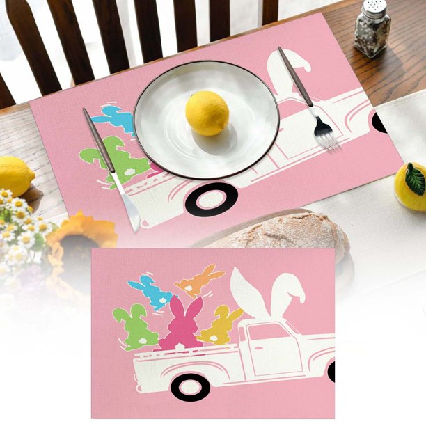 Manteles individuales de Pascua con bonitos conejitos, huevos y flores. Decoración festiva.