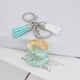 thumbnail image 2 of Llavero de letras con borlas verdes | Colgante de cristal acrílico | Lámina de oro, pegamento en gota, joyería de piedra engrosada | Amuleto de bolso con estilo, accesorio para mochila | 1 pieza, 2 of 2