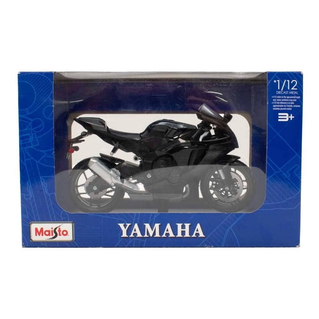 motocicleta de juguete maisto de metal de 1:12 negro yamaha réplica a escala 1:12 dentro de caja azul con ventana; vista 3/4 frontal de la moto en negro con escape plateado, llantas de radios, carenado y motor moldeados en metal y plástico, logo Maisto en la caja; apta para coleccionar y exhibir y suele usarse en dioramas de muestra.
