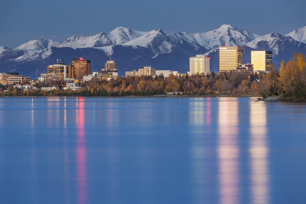 The Anchorage Skyline with the city lights reflected in the water of Knik Arm at high tide Snow covered Chugach Mountain in the background Knik Arm Cook Inlet Anchorage Southcentral Alaska USA Canvas