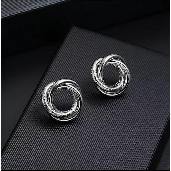 Clip on shiny and textured silver circle knot button earrings