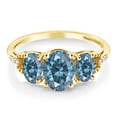 thumbnail image 2 of Gem Stone King 10K Yellow Gold Persian Blue Moissanite and White Diamond 3-Stone Engagement Ring for Women (2.32 Cttw, Oval 8X6MM and 6X4MM, Gemstone Birthstone, Size 7.5), 2 of 4