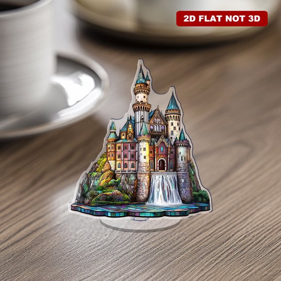 Rotating acrylic ornament featuring a vibrant castle, majestic mountains, and a waterfall, showcasing intricate details and luminous jewel tones in a stunning presentation