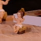 thumbnail image 4 of Decoraciones navideñas, adornos navideños, regalos navideños. Decoraciones navideñas con luz. Figura del Santo Niño sentado. Escultura de resina para escritorio. Estatua del personaje., 4 of 6