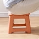 thumbnail image 1 of Folding Stool Small Plastic Portable Seat | Space Saving Foldable Design | Lightweight Compact Outdoor Home Office Use | Durable Safe Chamfered Edges | Blue Pink Red Orange | 1 Pc 23.5x20x19cm, 1 of 6