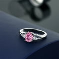 thumbnail image 4 of Gem Stone King 925 Sterling Silver Pink Moissanite and White Created Sapphire 3 Stone Engagement Ring for Women | 1.46 Cttw | Oval 8X6MM | Round 2MM | Gemstone Birthstone | Size 9, 4 of 4