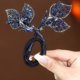 thumbnail image 4 of Horquilla con flor de strass, rulo para moño, rulo para pelo, horquilla con flor de strass, horquilla para moño fácil, horquilla para moño, horquilla para moño, horquillas para moños, 4 of 4