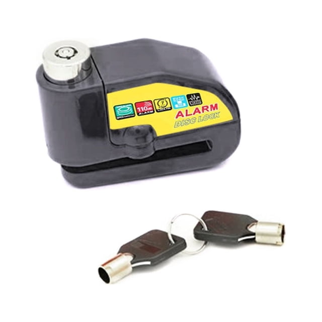candado de freno de disco de alarma de motocicleta candado de rueda de motocicleta antirrobo negro, vista frontal 3/4 de un candado de disco compacto con cuerpo negro y etiqueta amarilla que muestra "ALARM DISC LOCK", cilindro metálico superior y ranura para el disco; incluye dos llaves con cabezal negro. Alarma integrada de 110 dB que se activa con vibración; a menudo usado también para asegurar scooters y bicicletas deportivas en estacionamientos cortos.