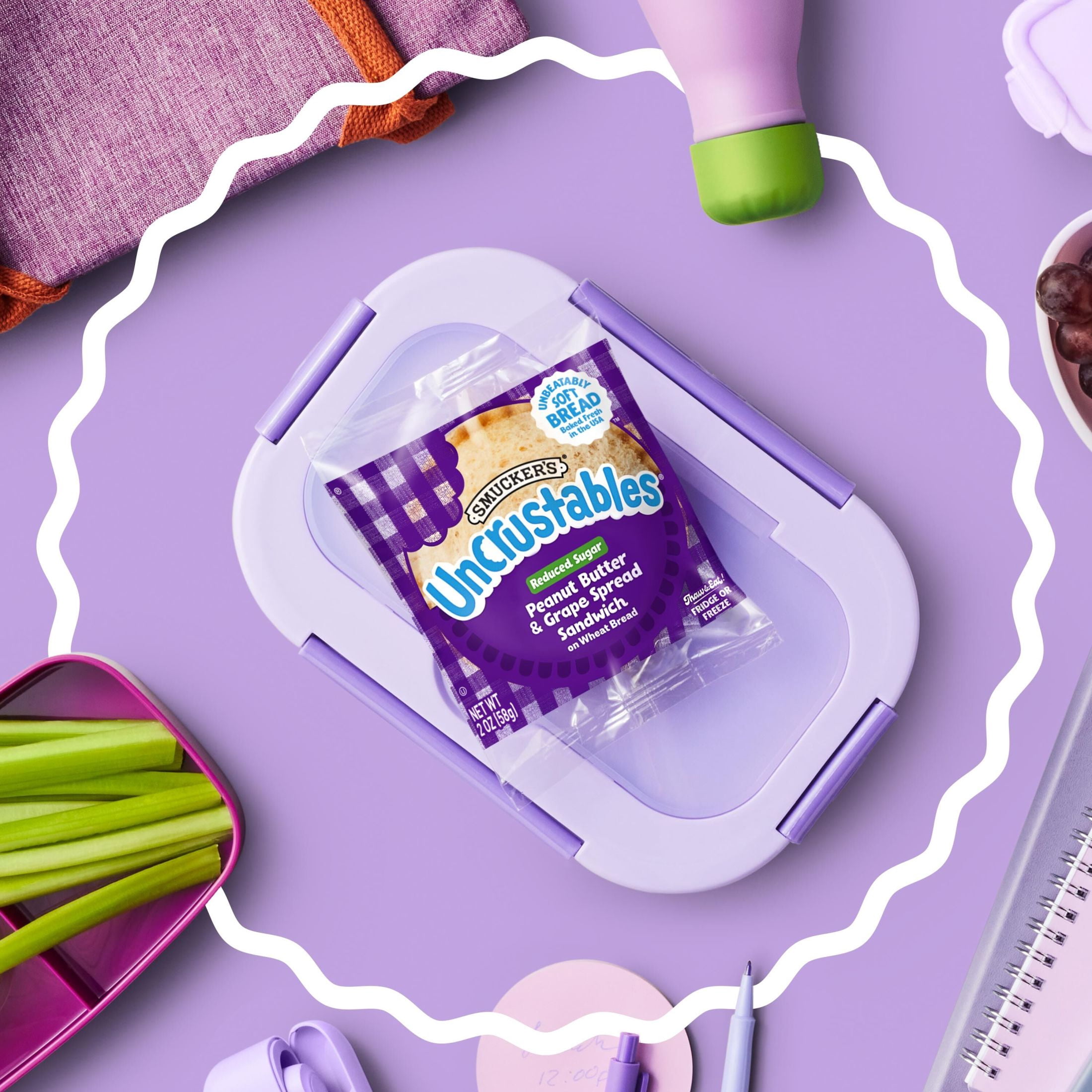 Smucker’s Uncrustables Reduced Sugar Peanut Butter & Grape Spread Sandwiches, 4 Count, 2 oz Each, Frozen