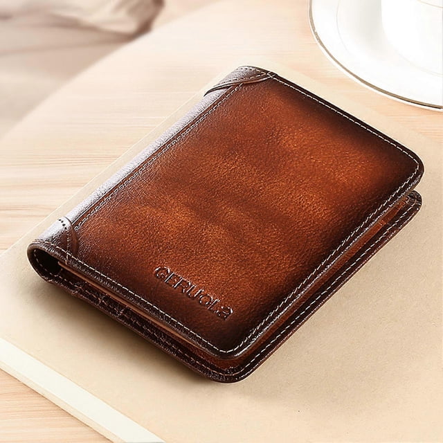 men's anti-theft rfid wallet simple ultra-thin design minimalist wallet gifts for men gentlemen brown polyester bifold wallet, centered 3/4 view showing slim folded silhouette, visible white stitching and embossed front text; smooth textured surface, dimensions 12×9.5×1.5cm per specs, placed on a light wood surface. Suitable as a compact card holder for travel and everyday carry.
